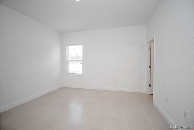 empty room with light tile patterned floors