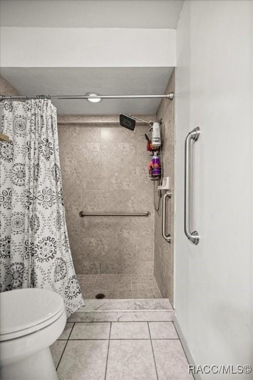 4357 N Indianhead Rd, Hernando, FL 34442 - full bathroom with tiled shower, tile patterned floors, and toilet
