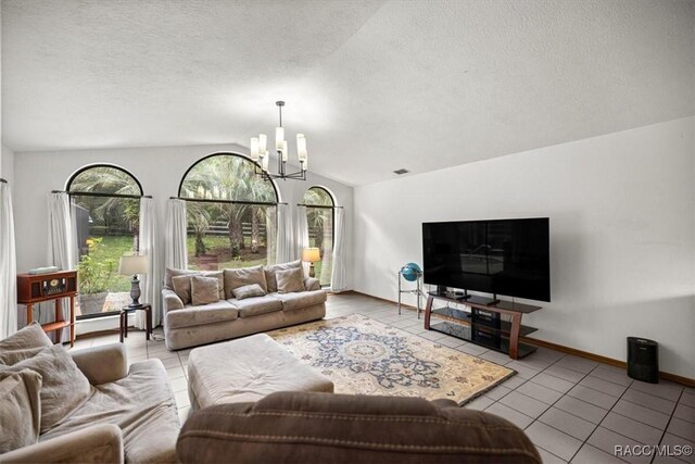 4357 N Indianhead Rd, Hernando, FL 34442 - tiled living area with lofted ceiling, a chandelier, a textured ceiling, and baseboards