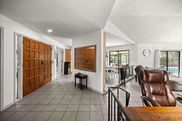 4357 N Indianhead Rd, Hernando, FL 34442 - foyer with light tile patterned floors, a textured ceiling, and baseboards