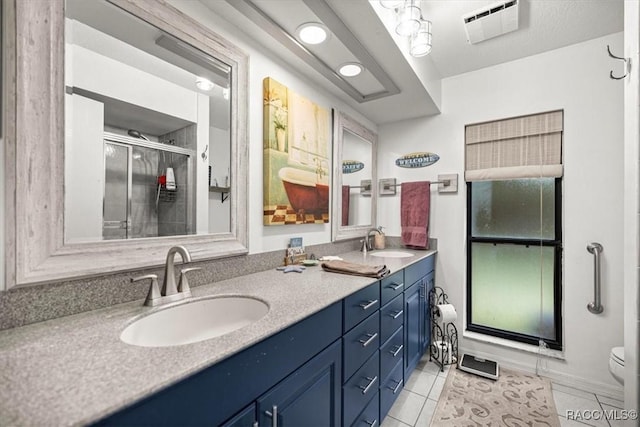 4357 N Indianhead Rd, Hernando, FL 34442 - full bathroom with tile patterned floors, a stall shower, double vanity, and toilet
