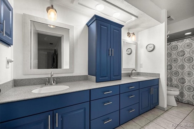 4357 N Indianhead Rd, Hernando, FL 34442 - bathroom featuring toilet, double vanity, tile patterned floors, and a shower with curtain