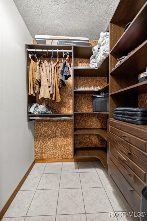 4357 N Indianhead Rd, Hernando, FL 34442 - spacious closet with light tile patterned flooring