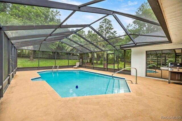 4357 N Indianhead Rd, Hernando, FL 34442 - outdoor pool with a patio, glass enclosure, and fence