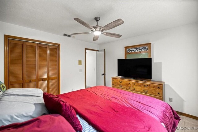 4357 N Indianhead Rd, Hernando, FL 34442 - bedroom with a closet, a ceiling fan, and baseboards
