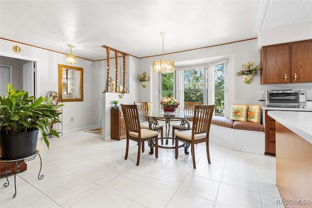 dining room featuring light tile patterned floors and a chandelier