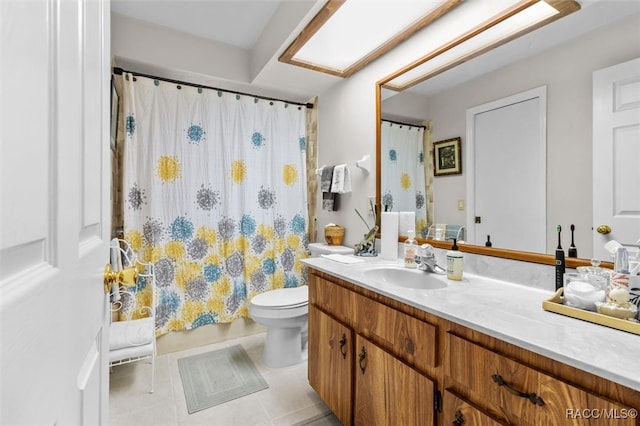 bathroom featuring tile patterned flooring, vanity, and toilet