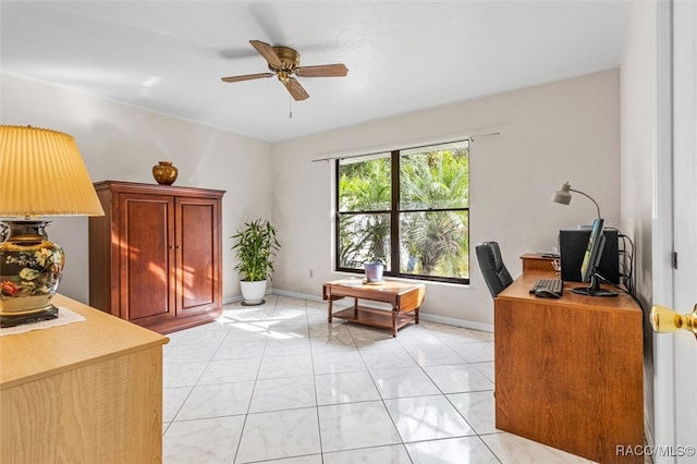 tiled home office featuring ceiling fan