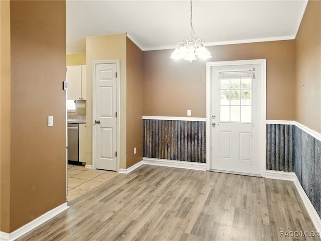 8599 N Messina Loop, Crystal River, FL 34428 - unfurnished dining area featuring a chandelier, light wood-type flooring, ornamental molding, and baseboards