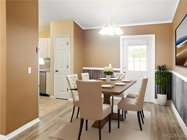 8599 N Messina Loop, Crystal River, FL 34428 - dining space featuring a chandelier, light wood-type flooring, ornamental molding, and baseboards