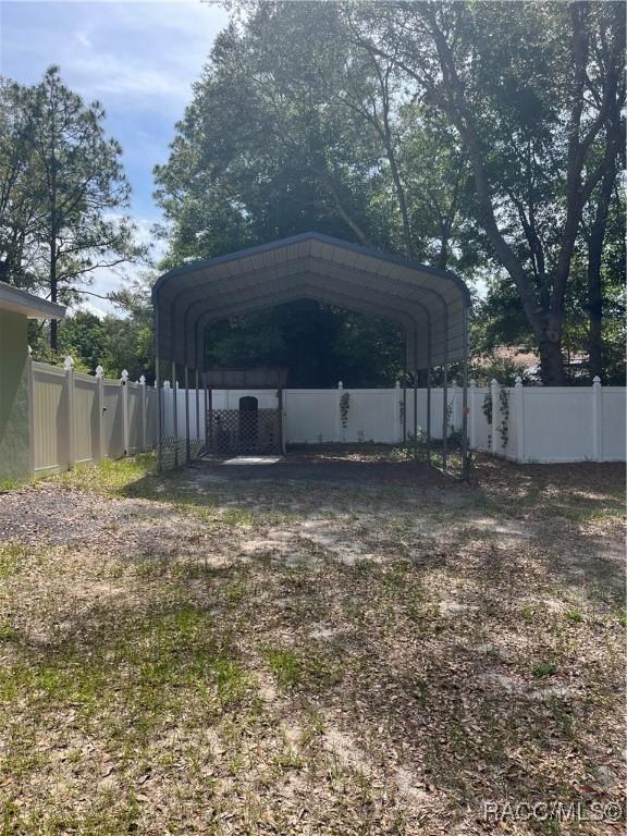8599 N Messina Loop, Crystal River, FL 34428 - view of outbuilding with a carport and driveway