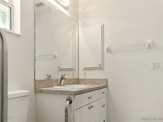 8599 N Messina Loop, Crystal River, FL 34428 - bathroom with vanity and toilet