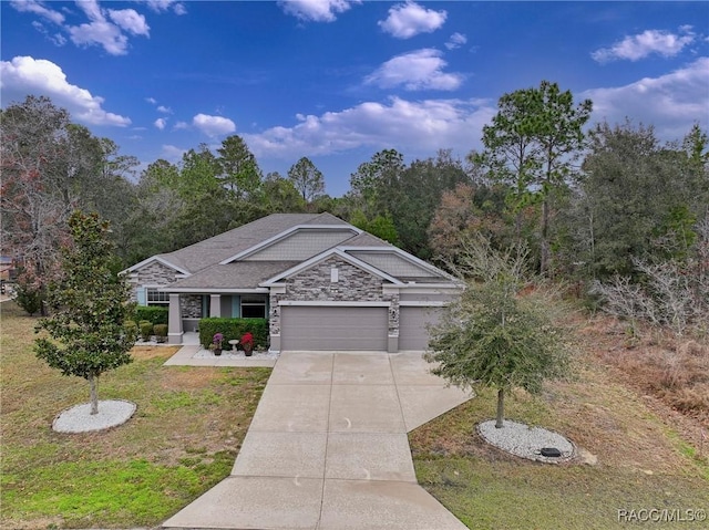 view of front facade with a garage and a front lawn