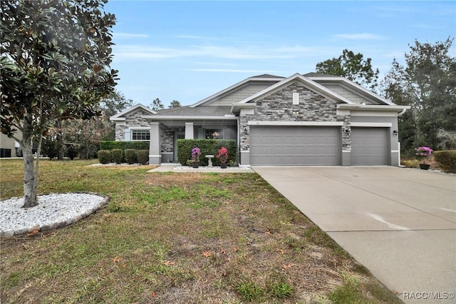 view of front of home with a garage and a front yard