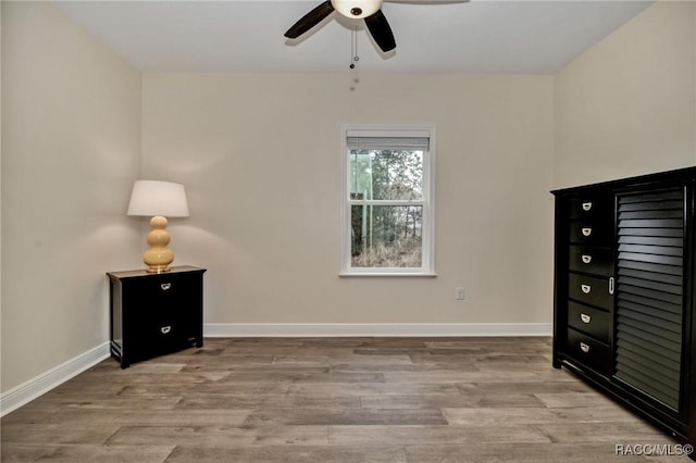 unfurnished bedroom with ceiling fan and light hardwood / wood-style floors