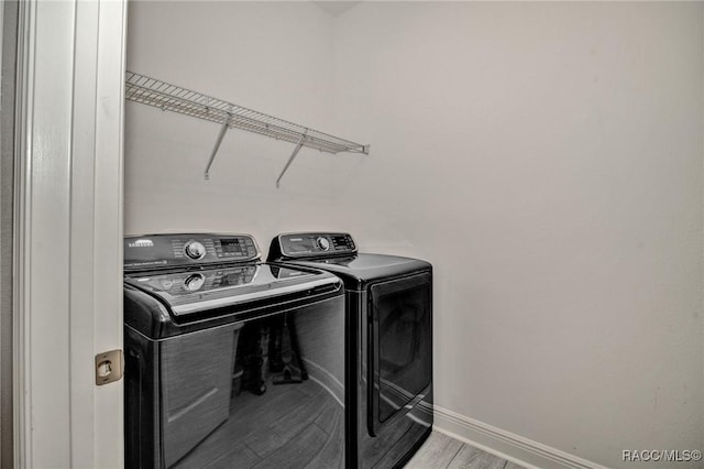 laundry room featuring washer and clothes dryer