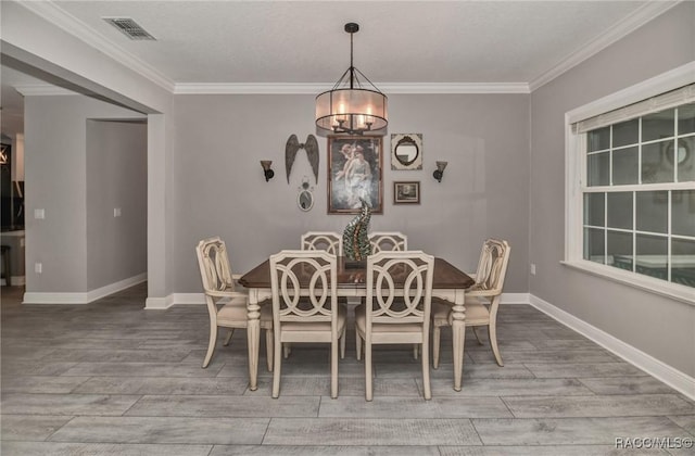 dining space featuring ornamental molding