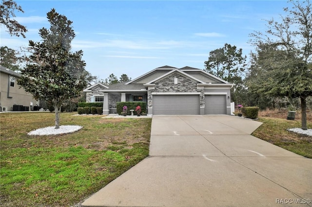 view of front of house featuring a garage and a front yard