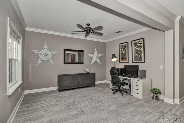 home office featuring crown molding, ceiling fan, light hardwood / wood-style flooring, and a textured ceiling