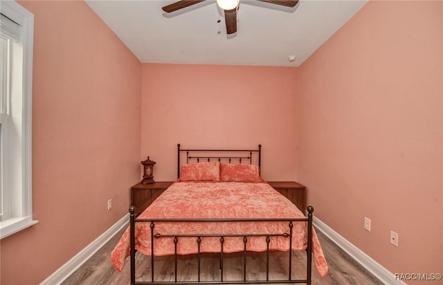 bedroom with ceiling fan and wood-type flooring