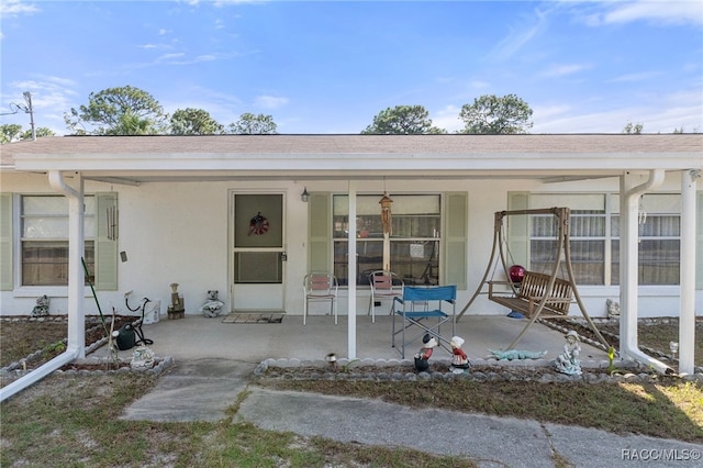 doorway to property featuring a porch