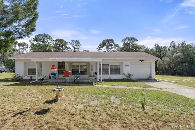 ranch-style house featuring driveway, a porch, a front lawn, and an attached garage