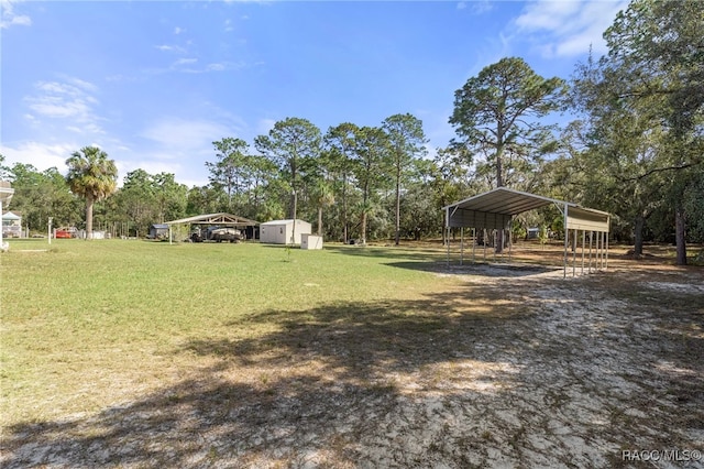 view of yard with a shed and a carport