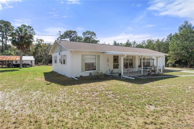 view of front of property with a porch and a front yard