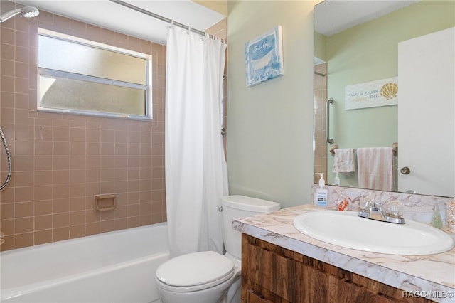 full bathroom featuring vanity, toilet, and shower / tub combo with curtain