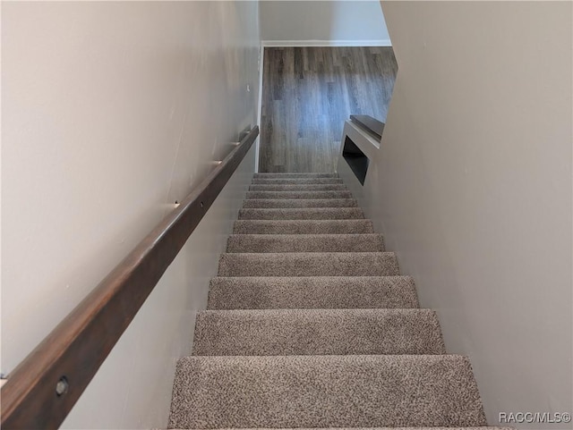 9781 E Goldfinch Ln, Inverness, FL 34450 - stairs with wood finished floors
