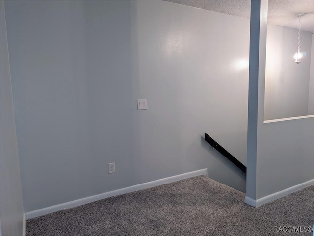 9781 E Goldfinch Ln, Inverness, FL 34450 - stairs featuring carpet, a textured ceiling, and baseboards