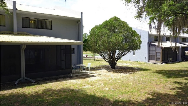 9781 E Goldfinch Ln, Inverness, FL 34450 - view of grassy yard with a sunroom