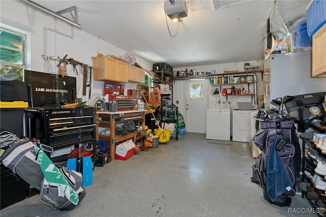 garage featuring washing machine and dryer and a garage door opener