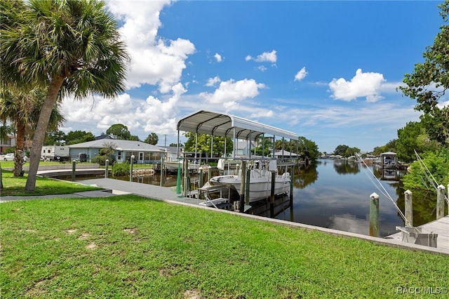 dock area with a water view and a yard