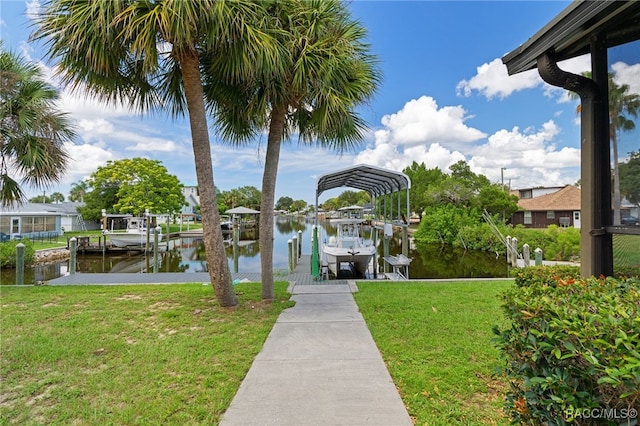 view of dock featuring a water view and a yard