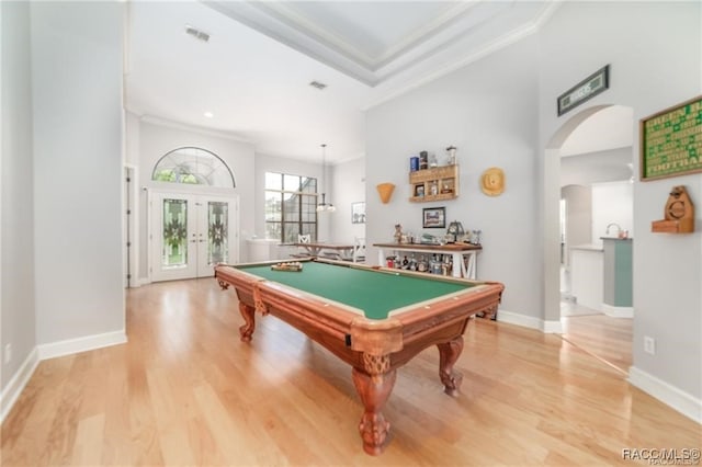 game room with french doors, hardwood / wood-style flooring, crown molding, and billiards