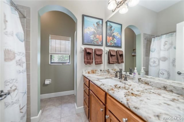 bathroom featuring a shower with curtain, tile patterned flooring, and vanity