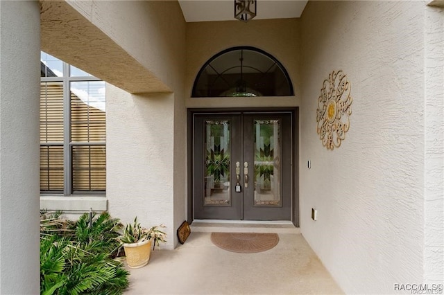 entrance to property featuring french doors