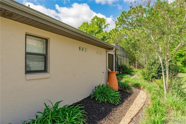 view of property exterior with a lanai