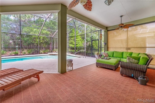 sunroom featuring ceiling fan and a pool