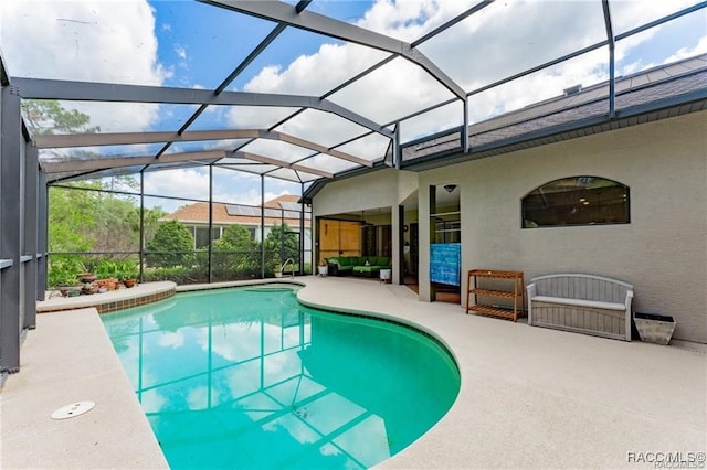 view of swimming pool featuring a lanai, a patio area, and outdoor lounge area