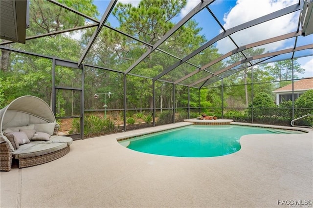 view of swimming pool featuring a lanai and a patio area