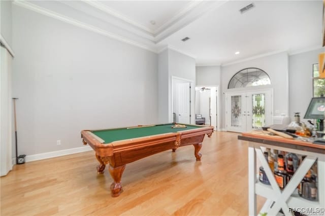 game room with hardwood / wood-style floors, ornamental molding, pool table, and french doors