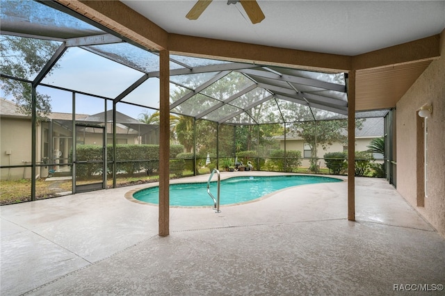 pool featuring a patio, a lanai, and a ceiling fan