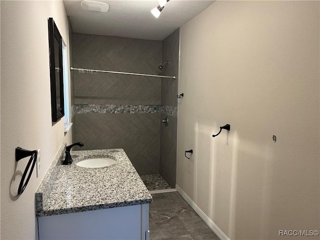 bathroom featuring vanity and walk in shower