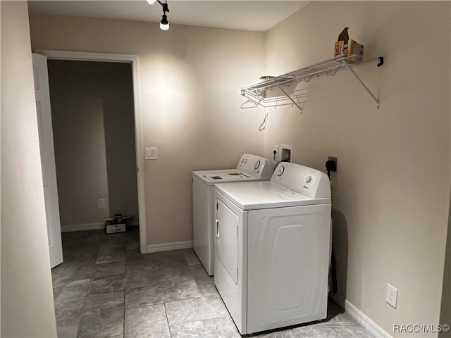 laundry area with washing machine and dryer