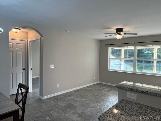 spare room with ceiling fan