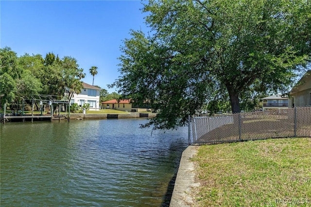 view of water feature with fence