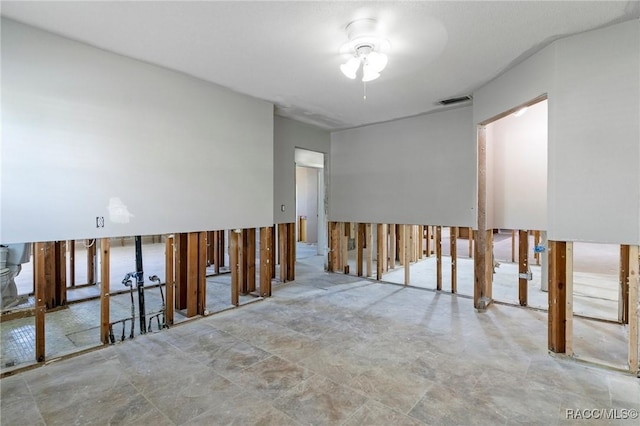 unfurnished room featuring visible vents