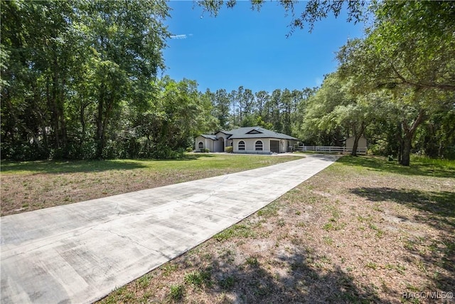5079 W Pinto Loop, Beverly Hills, FL 34465 - surrounding community with driveway and a lawn